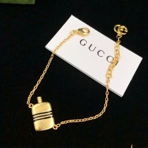 Gucci Double G Bottle Pendant Bracelets In Gold