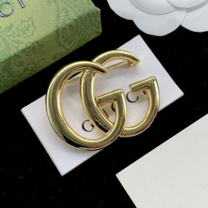 Gucci Double G Brooch In Gold