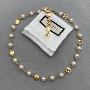 Gucci Interlocking G Flower Pearl Necklace In Gold