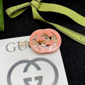 Gucci Interlocking G Silicone Hair Slides In Gold/Pink
